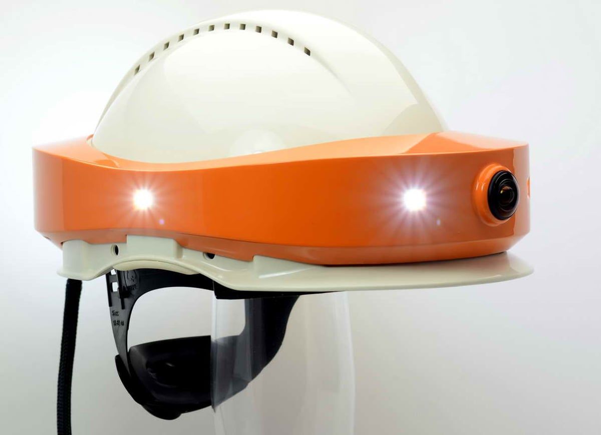 DIGIBAU-360-Helm von der Seite mit eingeschalteten Power-LEDs am orangen Kameraaufsatz